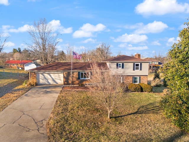 view of front facade featuring a garage and a front lawn