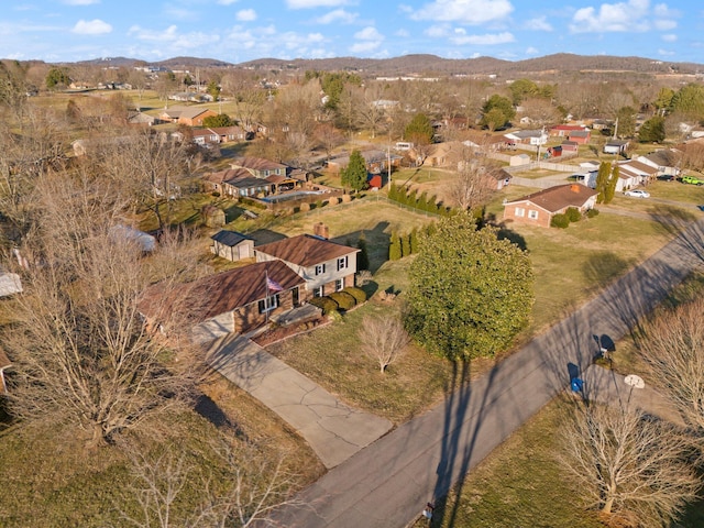 birds eye view of property with a mountain view