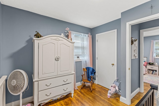 bedroom with hardwood / wood-style floors