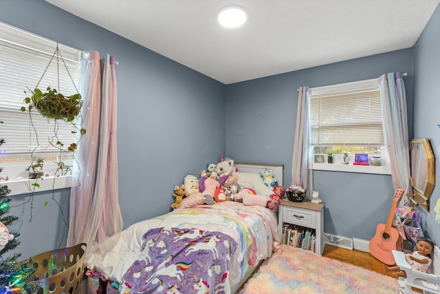 bedroom with wood-type flooring