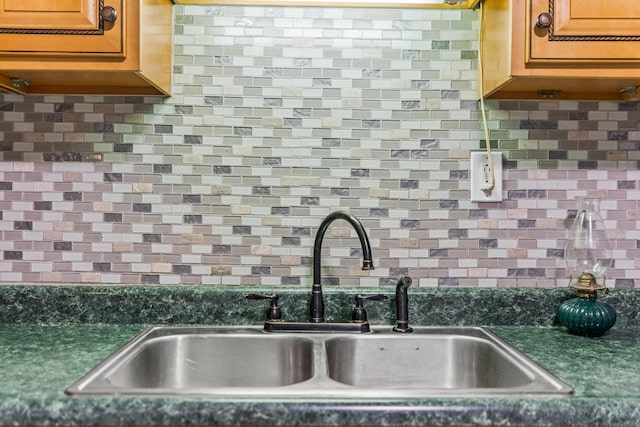 kitchen with decorative backsplash and sink