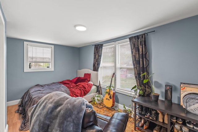 bedroom with hardwood / wood-style flooring