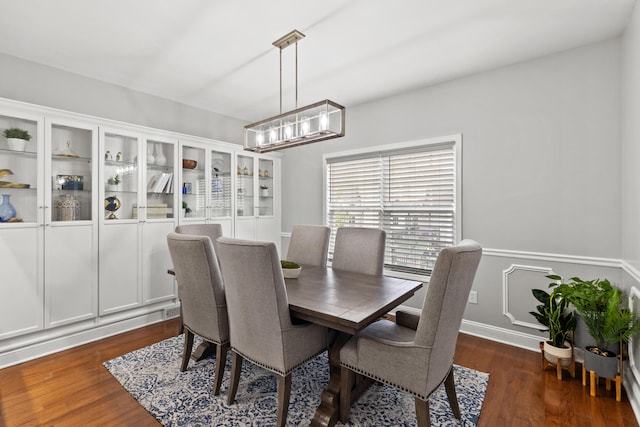 dining space featuring dark hardwood / wood-style flooring