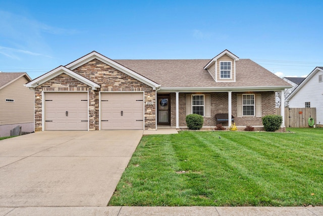 view of front facade with a front yard and a garage