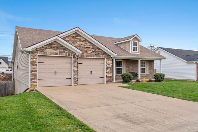 view of front of house with a front lawn and a garage