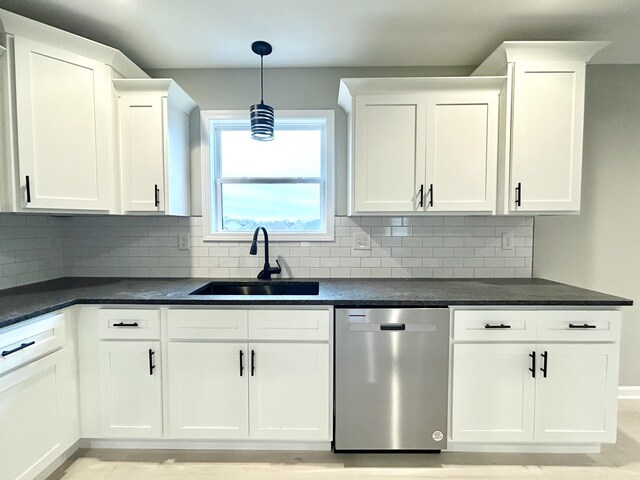 kitchen with dark countertops, a healthy amount of sunlight, lofted ceiling with beams, and visible vents