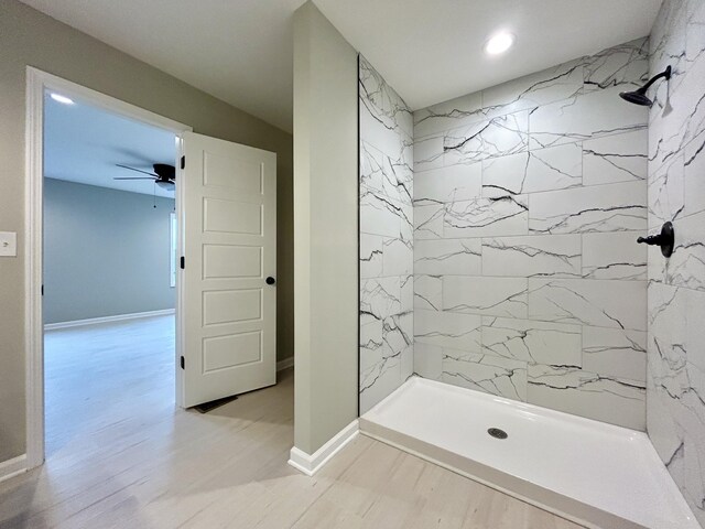 full bath with double vanity, a sink, and baseboards