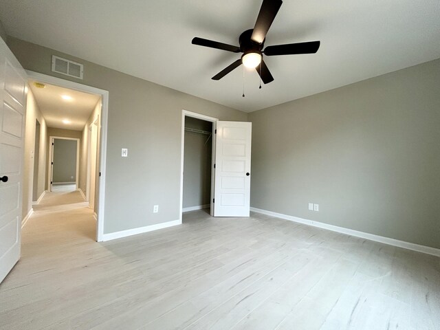 bathroom with vanity, baseboards, and wood finished floors