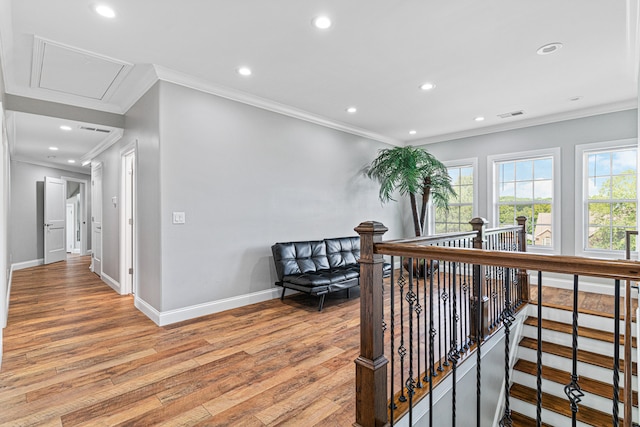 corridor featuring hardwood / wood-style flooring and ornamental molding