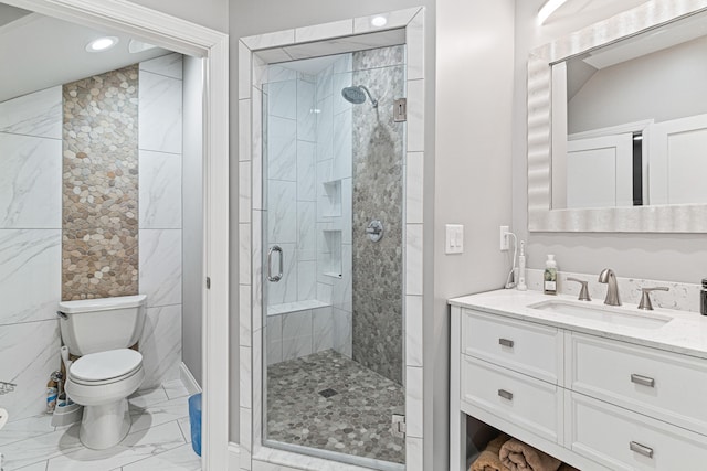 bathroom featuring walk in shower, vanity, and toilet