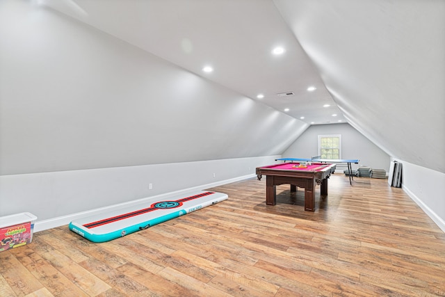 game room with light wood-type flooring, lofted ceiling, and billiards