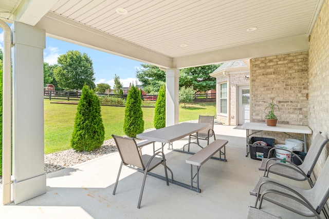 view of patio featuring a fireplace