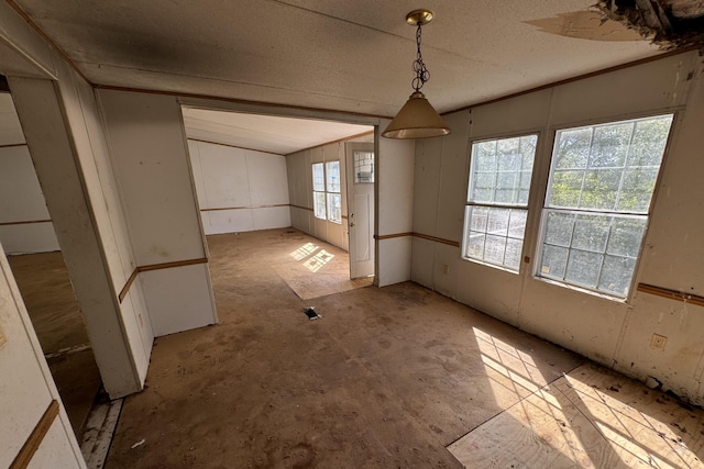 unfurnished dining area featuring plenty of natural light