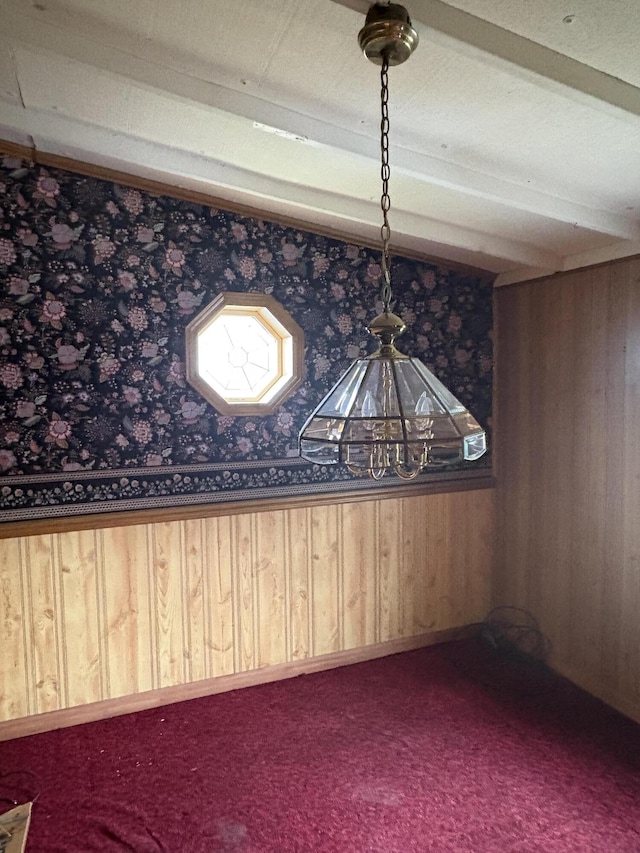 unfurnished dining area with wood walls