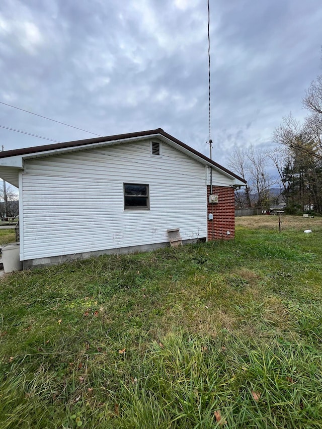 view of home's exterior featuring a yard