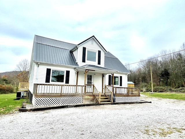 view of front of property featuring covered porch and central AC unit