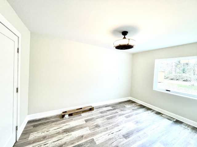 spare room featuring light hardwood / wood-style floors