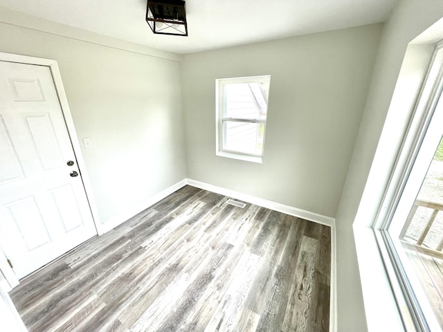 spare room featuring dark hardwood / wood-style floors