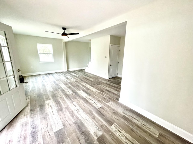 empty room featuring hardwood / wood-style floors and ceiling fan