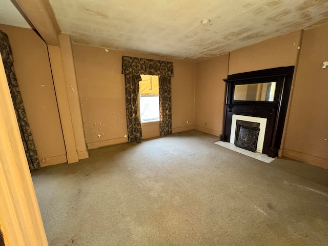 unfurnished living room featuring carpet flooring