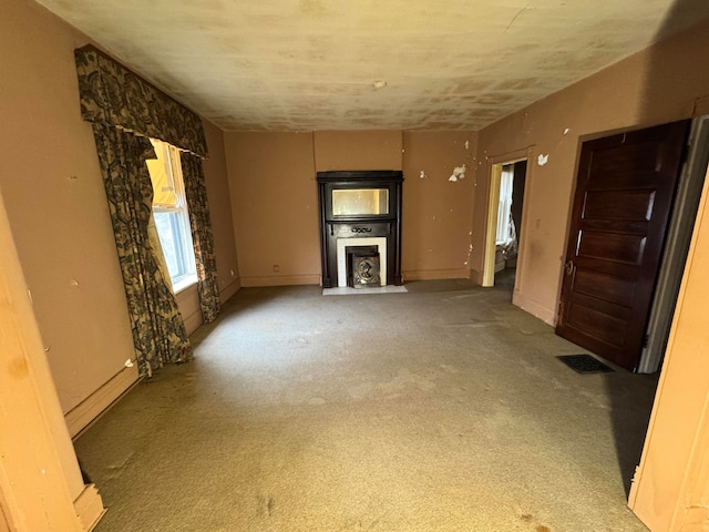 unfurnished living room with carpet flooring