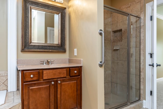 bathroom featuring vanity and a shower with door