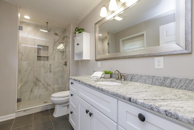 bathroom featuring toilet, a shower with curtain, tile patterned floors, and vanity