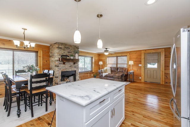 log cabin with covered porch, a front lawn, and ceiling fan