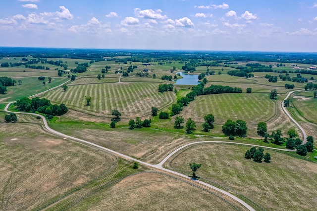 bird's eye view with a water view and a rural view