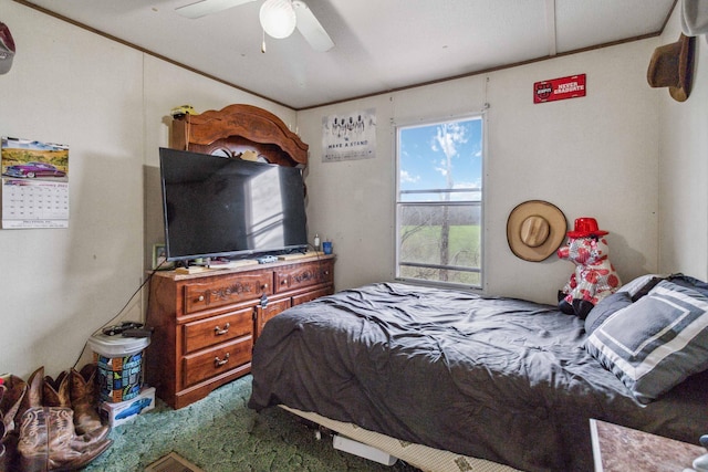 carpeted bedroom with crown molding and ceiling fan