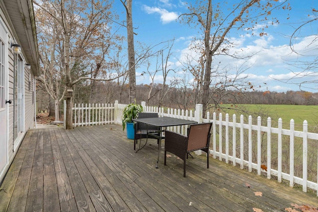 wooden deck featuring outdoor dining area