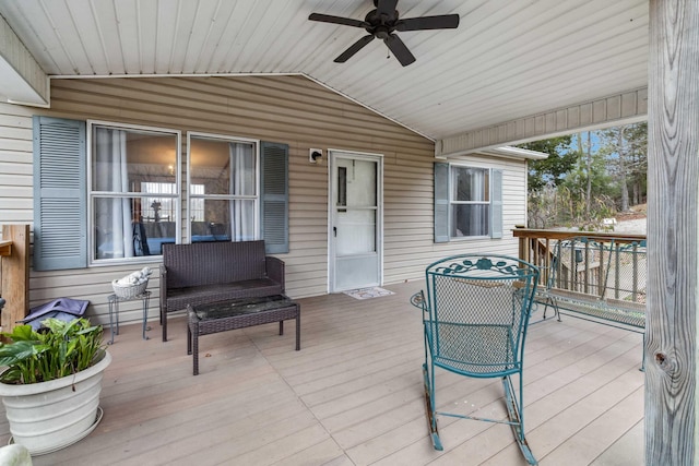 wooden terrace featuring ceiling fan