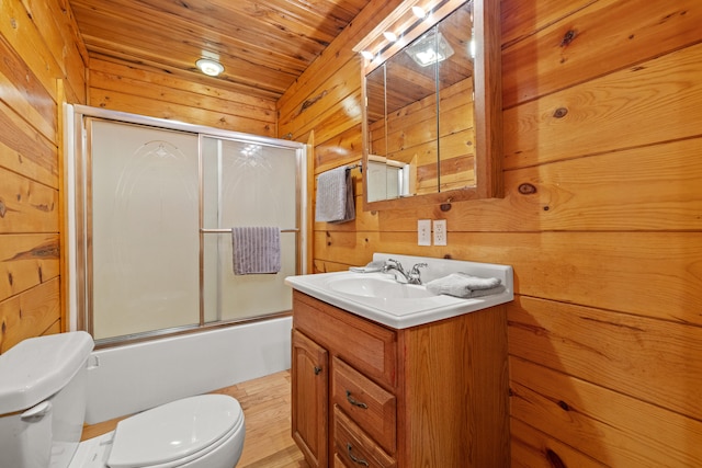 full bathroom with wooden walls, toilet, and wooden ceiling