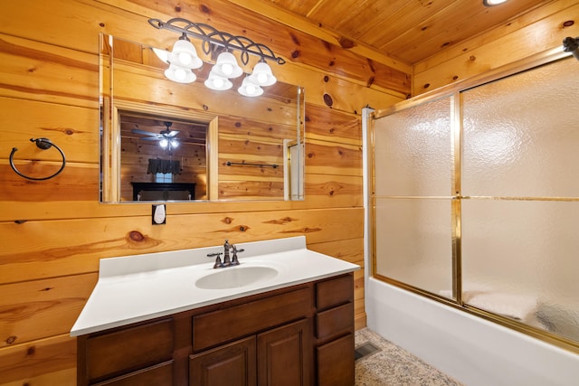 bathroom featuring enclosed tub / shower combo, vanity, wooden ceiling, and wooden walls