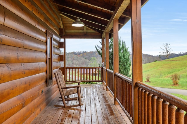 wooden terrace featuring a porch