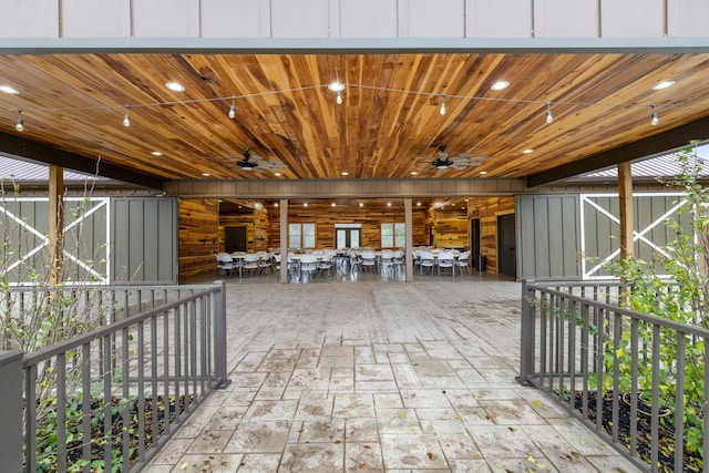 view of patio featuring ceiling fan