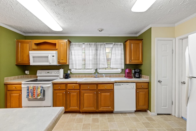 kitchen with a textured ceiling, white appliances, ornamental molding, and sink