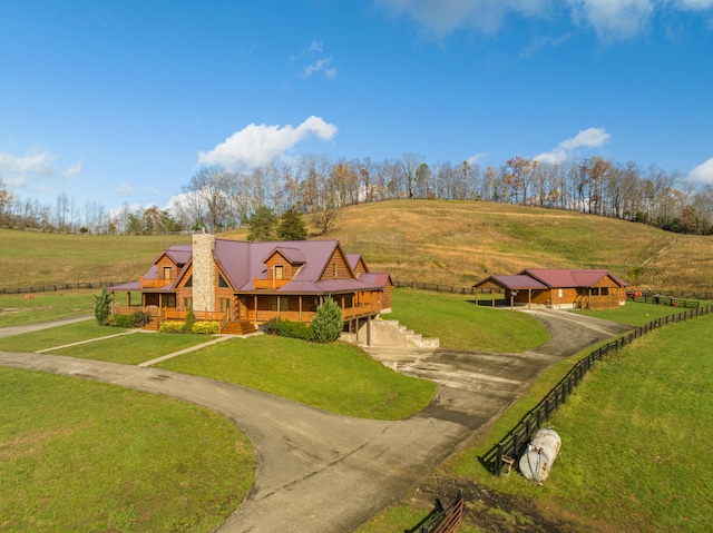 birds eye view of property with a rural view