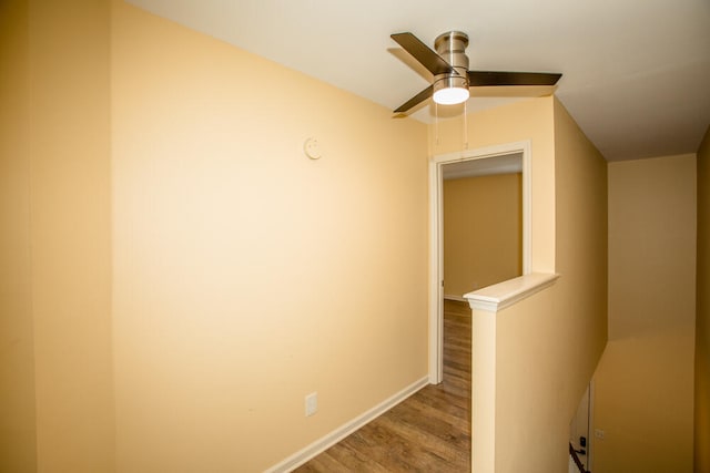 hallway with light hardwood / wood-style floors