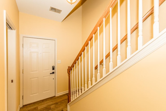 foyer with dark wood-type flooring