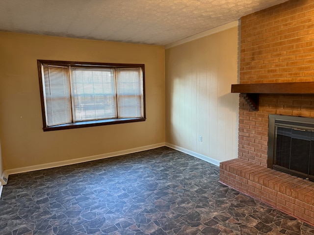 unfurnished living room with a fireplace and a textured ceiling