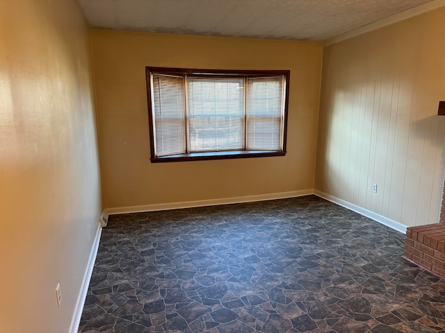 spare room with a textured ceiling