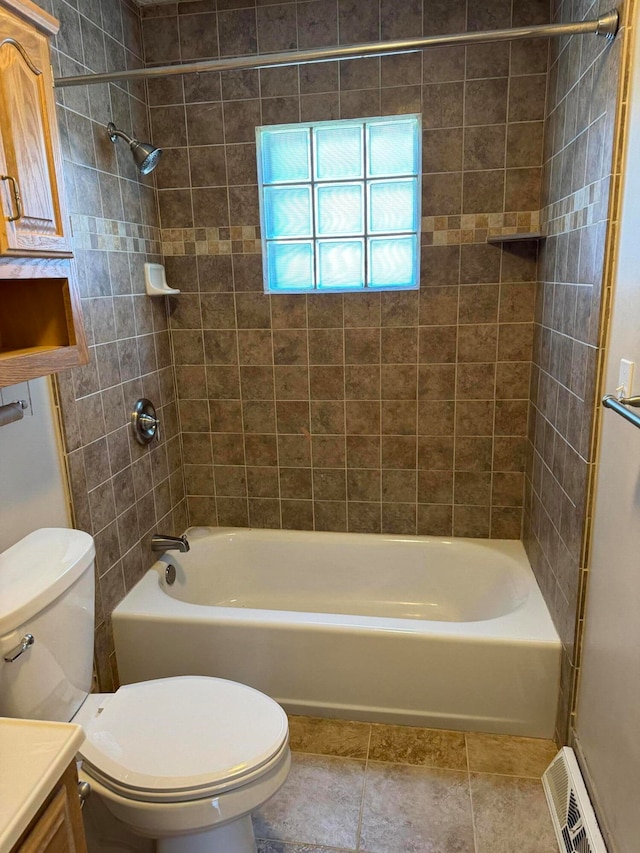 full bathroom featuring vanity, toilet, and tiled shower / bath