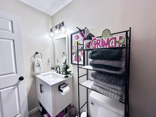 bathroom featuring vanity and toilet