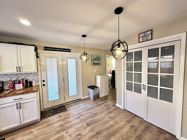 unfurnished dining area with light hardwood / wood-style flooring