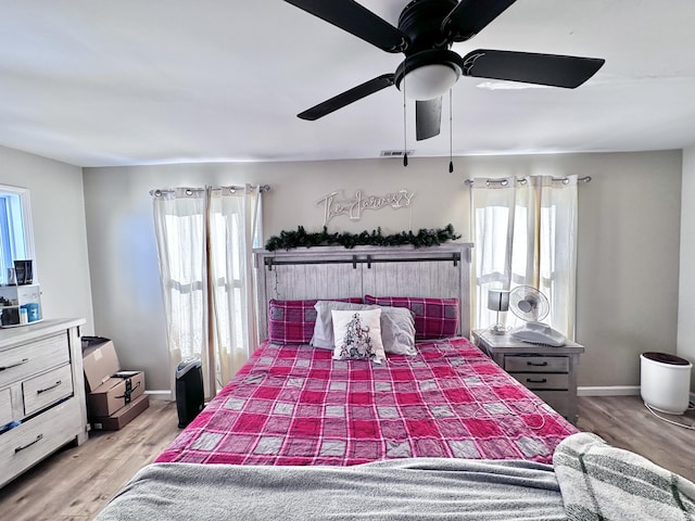 bedroom featuring ceiling fan and wood-type flooring