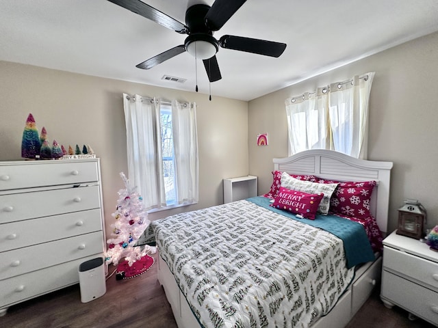 bedroom with ceiling fan and dark hardwood / wood-style flooring