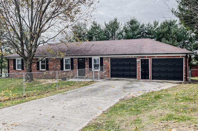 ranch-style home with a garage and a front lawn