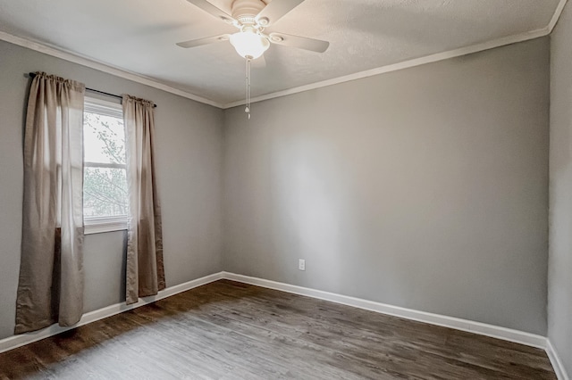 unfurnished room featuring dark hardwood / wood-style floors, ceiling fan, and crown molding