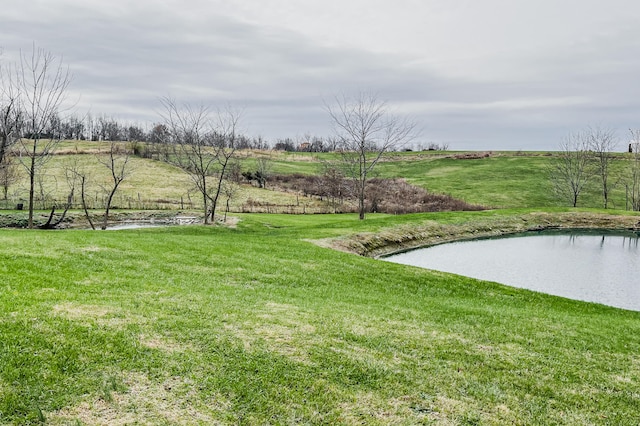 view of yard featuring a water view and a rural view